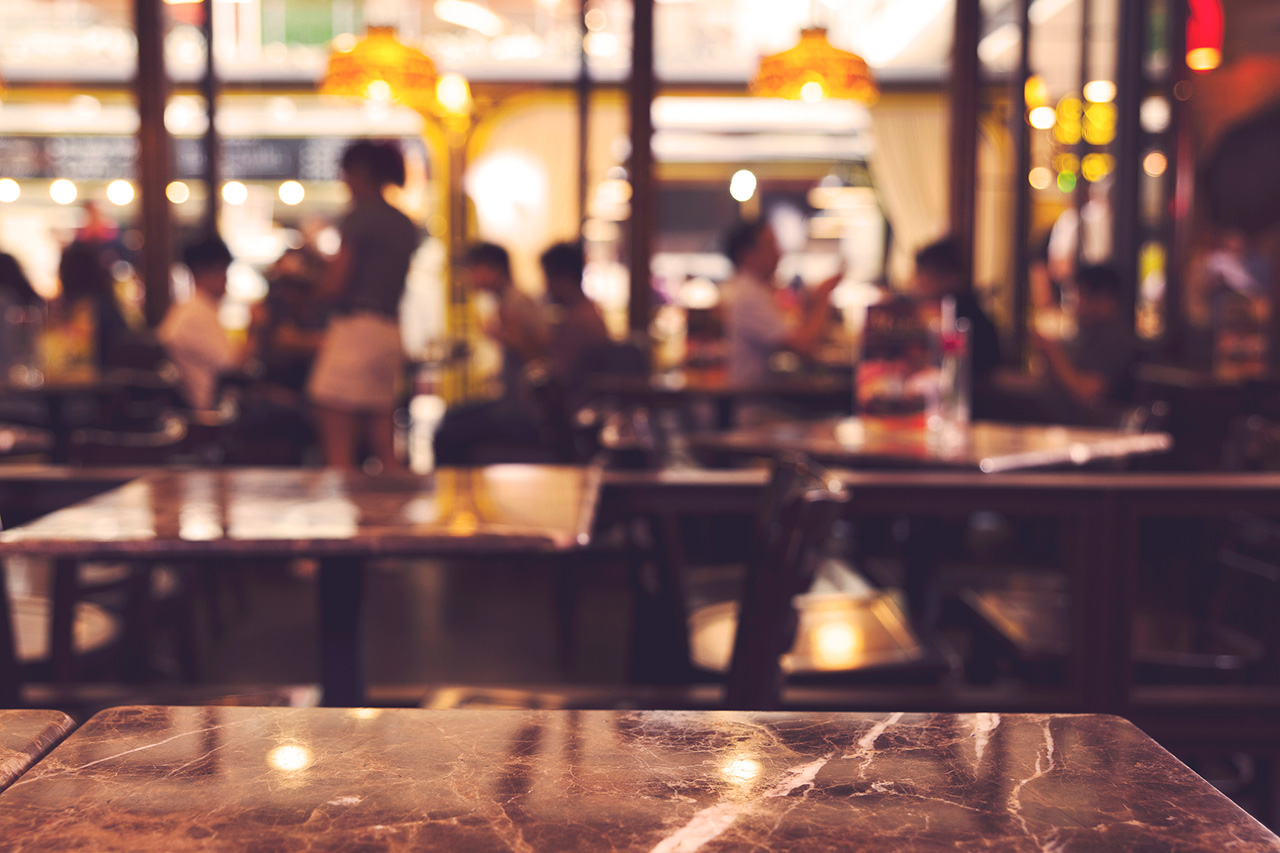 Abstract blurred background of restaurant interior , vintage filter applied.